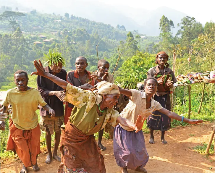 Members of a Batwa community performing a traditional dance near Bwindi